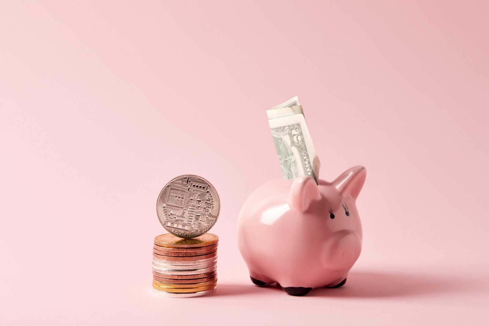 Buying a House With Cryptocurrency - Stack of Bitcoins and Piggy Bank With Cash